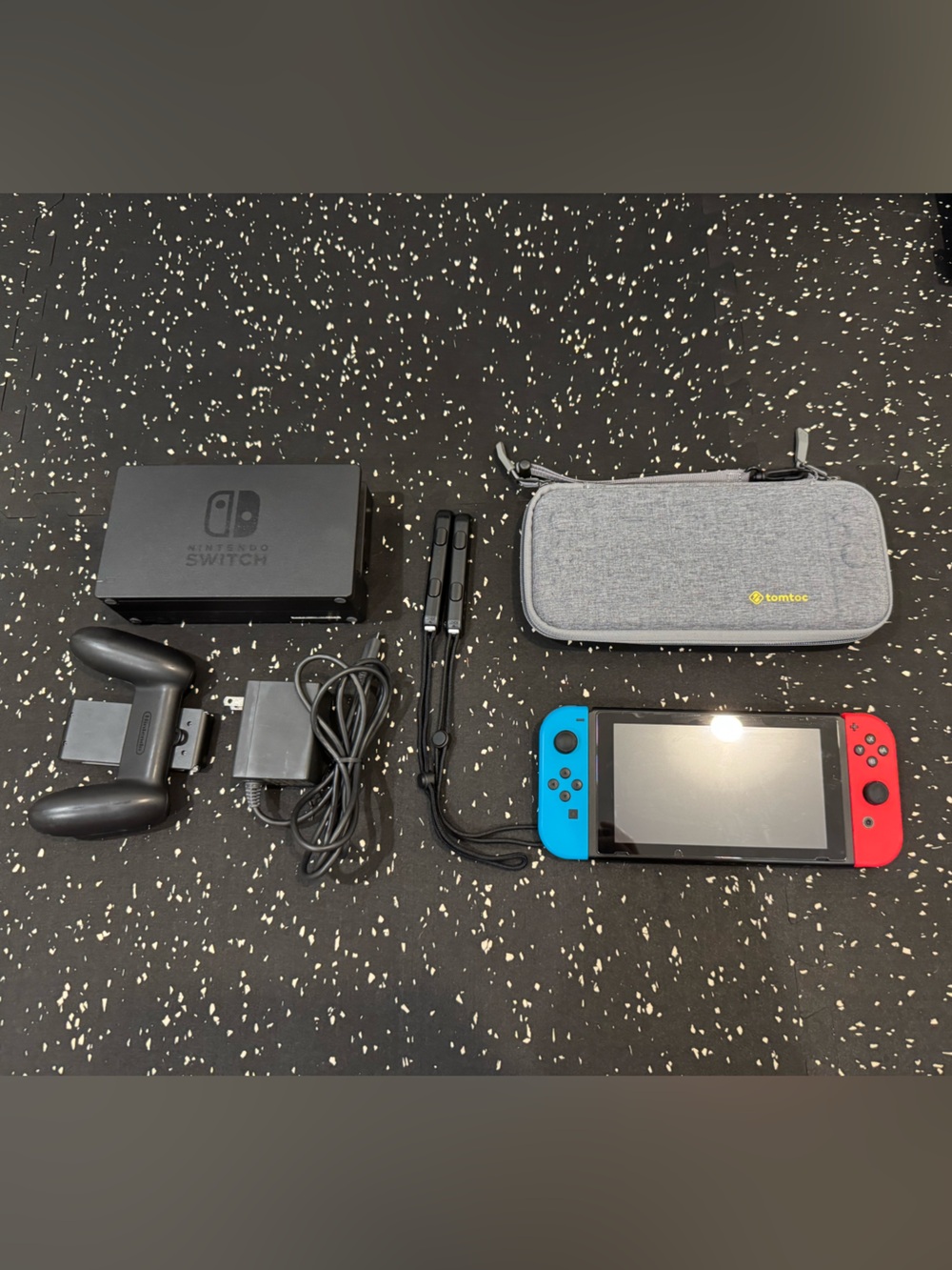 Nintendo Switch with Neon Red & Neon Blue Joy‑Con and Gray Carry Case